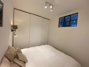 Krevet ili kreveti u jedinici u objektu Nieuwpoort in 't zonneke - appartement met terras