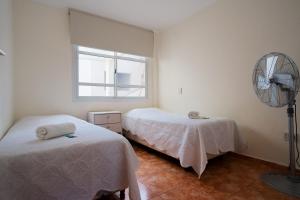 Regia Apartamentos Posadas客房内的一张或多张床位