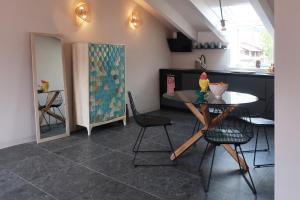 a kitchen and dining room with a table and chairs at Picobello Lago in Mandello del Lario