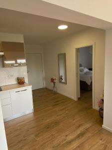 an empty room with a kitchen and a bedroom at Country House Peace in Drinovci