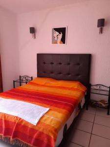 Postel nebo postele na pokoji v ubytování bel appart refait à neuf sur Tamouda Bay Tétouan