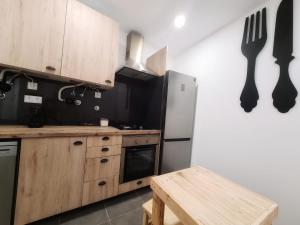 Kuchyň nebo kuchyňský kout v ubytování COIMBRA CITY CHARM