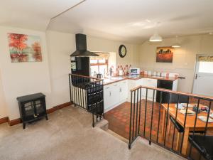 a kitchen with a table and a counter top at Meadows Edge in Holwick