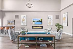 a living room with a ping pong table at Fountain Park Hotel BW Signature Collection in Fountain Hills