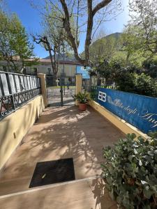 a walkway with a fence and a gate at B&B Villa degli Angeli in Praia a Mare