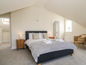 Un pat sau paturi într-o cameră la Skiddaw Heights