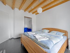 Postel nebo postele na pokoji v ubytování Öko-Chalet Sauerland nahe Rennstrecke 707