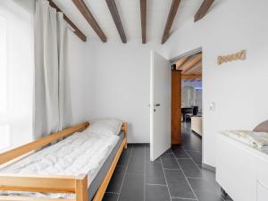 Postel nebo postele na pokoji v ubytování Öko-Chalet Sauerland nahe Rennstrecke 707