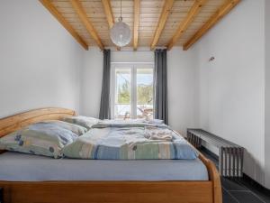 Postel nebo postele na pokoji v ubytování Öko-Chalet Sauerland nahe Rennstrecke 707