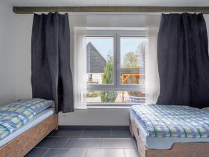 Postel nebo postele na pokoji v ubytování Öko-Chalet Sauerland nahe Rennstrecke 707
