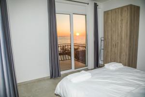 Postel nebo postele na pokoji v ubytování Soluna Apartments + 27 fotografií