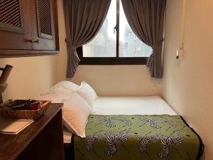 Postel nebo postele na pokoji v ubytování 拉開門輕旅 Le Passage Hostel