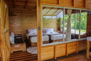 Postel nebo postele na pokoji v ubytování Cacao Glamping + 29 fotografií