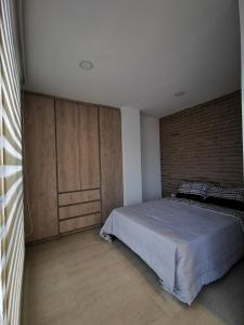 Ένα ή περισσότερα κρεβάτια σε δωμάτιο στο Apartamento exclusivo en Manizales-Gran ubicación!