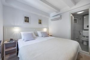 Posteľ alebo postele v izbe v ubytovaní Rooms Andro