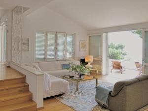 a living room with a couch and a table at Villa Marina in Brela
