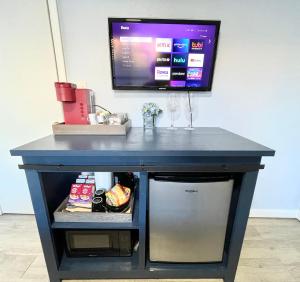 a blue desk with a tv on top of it at Golden Gate Park Suite in San Francisco