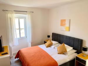 Postel nebo postele na pokoji v ubytování Apartments Casa Toni Dubrovnik