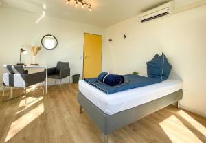 Postel nebo postele na pokoji v ubytování Hegau Boardinghouse