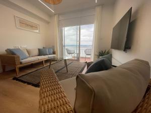 A television and/or entertainment centre at Oktheway Perbes Beach 2
