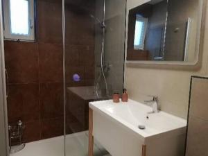 a bathroom with a shower and a sink and a shower at Visum Residence Labin in Labin +23 photos