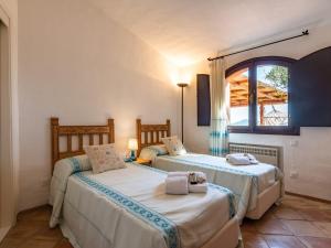 Säng eller sängar i ett rum på Pevero Retreat: Tra il Golf e il Mare