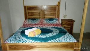 מיטה או מיטות בחדר ב-Chez Bethy Jungle et Océan