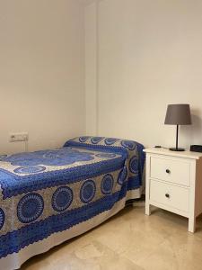 En eller flere senge i et værelse på Apartamento Costa de la Luz