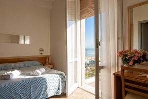 Postel nebo postele na pokoji v ubytování Hotel Atlas