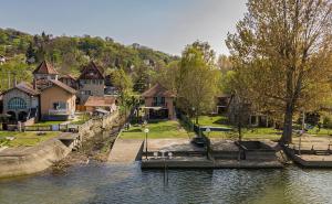 a group of houses on the side of a river at Dunavska Kuća in Smederevo