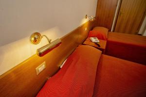 Postelja oz. postelje v sobi nastanitve Hotel Roccaporena & Margherita