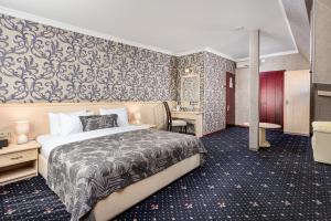 Postel nebo postele na pokoji v ubytování Sharden Hotel