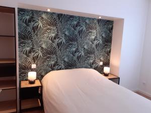 Postel nebo postele na pokoji v ubytování KALEE APPARTEMENT T2
