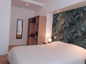 Postel nebo postele na pokoji v ubytování KALEE APPARTEMENT T2