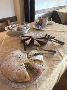 a table with a plate of bread on a table at Agriturismo Al Col in Follina +16 photos
