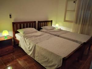 Ένα ή περισσότερα κρεβάτια σε δωμάτιο στο Santos`s House
