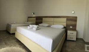 Postel nebo postele na pokoji v ubytování Apartments kupi ul rudaj 41