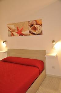 Postel nebo postele na pokoji v ubytování Brezza di mare Gaeta b&b
