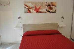 Postel nebo postele na pokoji v ubytování Brezza di mare Gaeta b&b