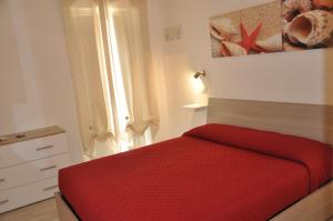 Postel nebo postele na pokoji v ubytování Brezza di mare Gaeta b&b