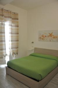 Postel nebo postele na pokoji v ubytování Brezza di mare Gaeta b&b