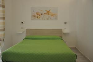 Postel nebo postele na pokoji v ubytování Brezza di mare Gaeta b&b
