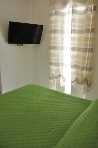 TV a/nebo společenská místnost v ubytování Brezza di mare Gaeta b&b