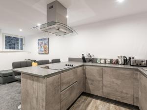 a kitchen with a sink and a counter top at Casa Fresa - Castle Heights Apartment in Dundee