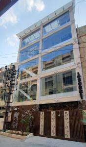 a large glass building with a lot of windows at B R Inn in Bangalore