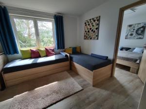 Postel nebo postele na pokoji v ubytování Apartman pod lipou - samostatny objekt - carport