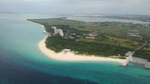 an aerial view of an island in the ocean at Guest House Miyakojima in Miyako-jima