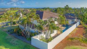 an aerial view of a house with palm trees at Aloha 'Ohana home in Koloa