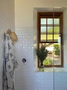 a bathroom with a shower with a glass door at Penhill Farm Manor House in Nuy
