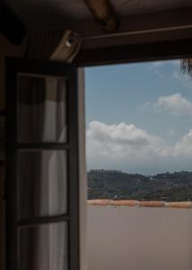 a view from a window of a boat in the water at La Posada Morisca in Frigiliana